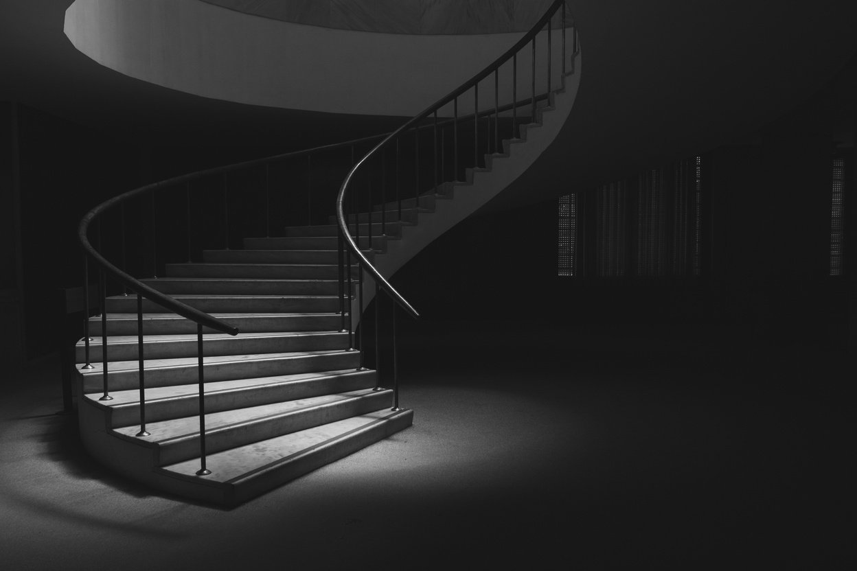 A Spiral Staircase in Black and White Photo